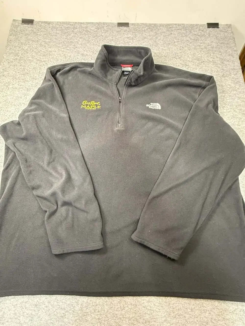 The North Face Black 1/2 Zip Fleece Pullover with Crown Royal Maple Finished